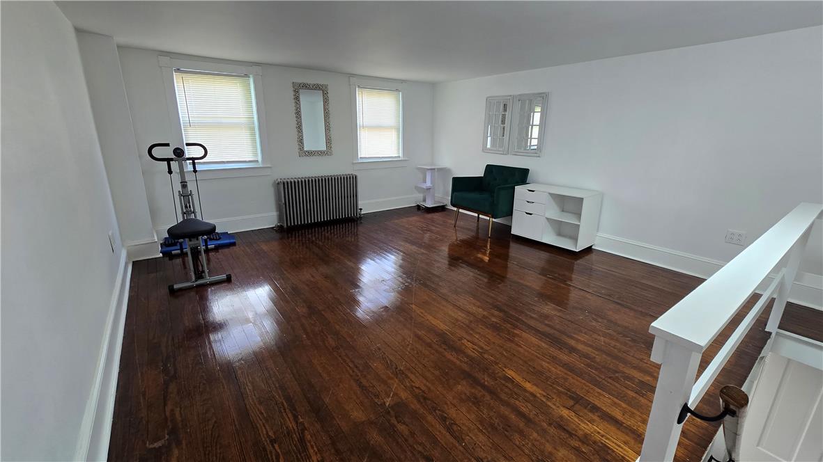 883 North Locust Street Hazleton, PA 18201 - Photo 62 of 83 Rich hardwood flooring stretches across this adaptable room, offering generous natural light.