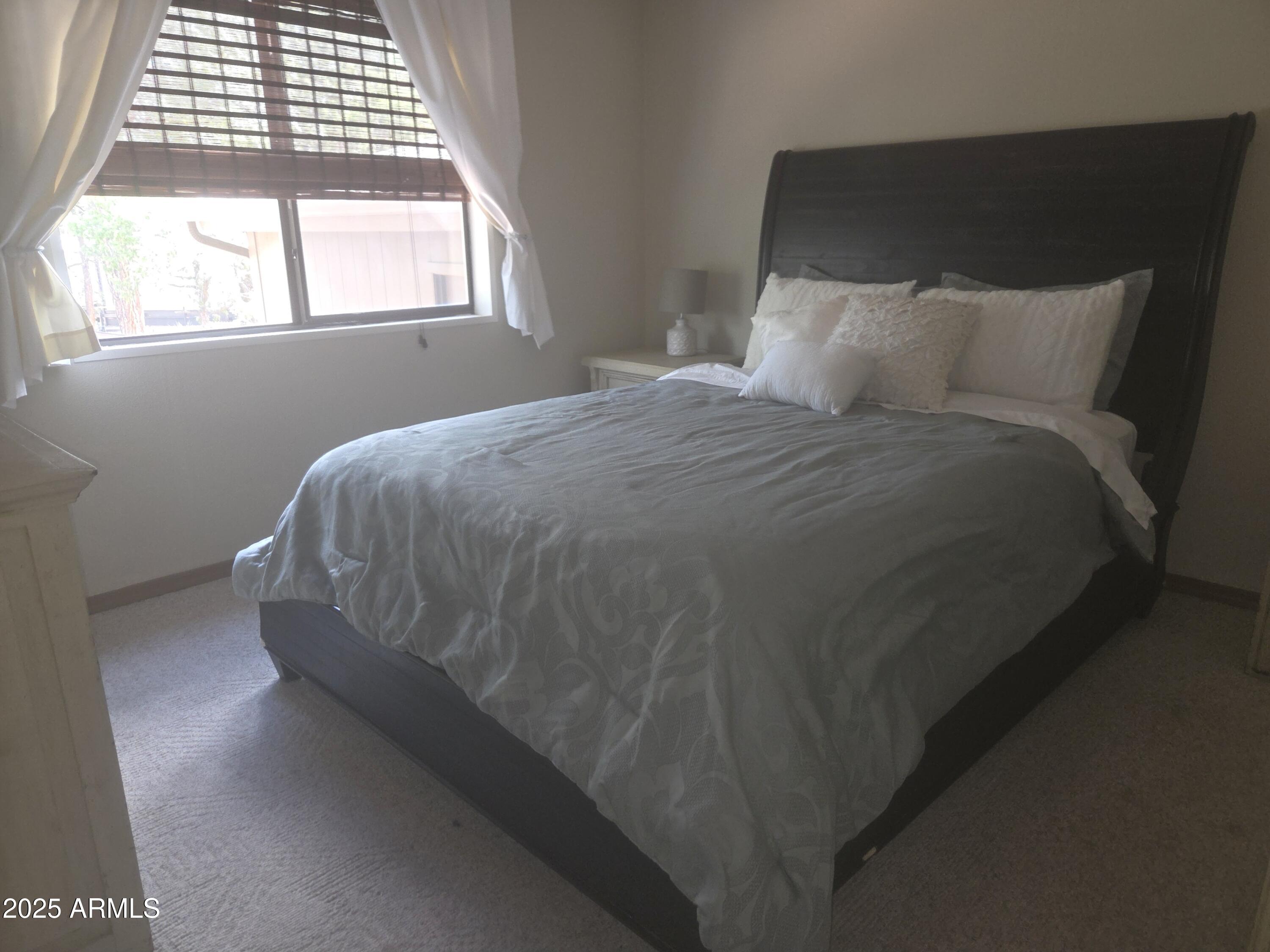 115 South Young Road Payson, AZ 85541 - Photo 11 of 34 a bedroom with a bed and window