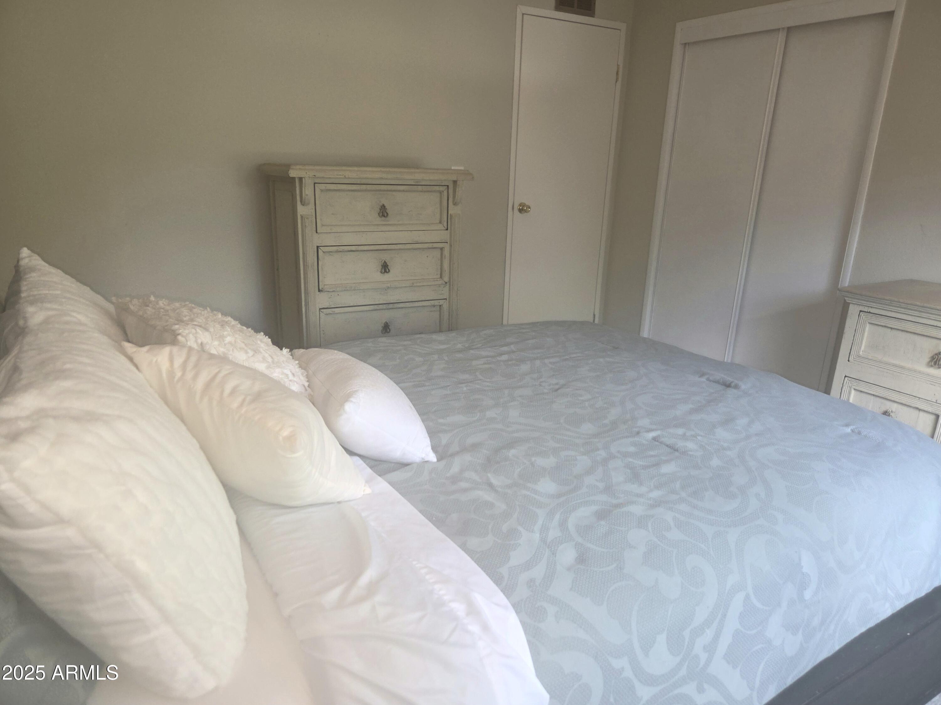 115 South Young Road Payson, AZ 85541 - Photo 12 of 34 a bedroom with a bed and closet