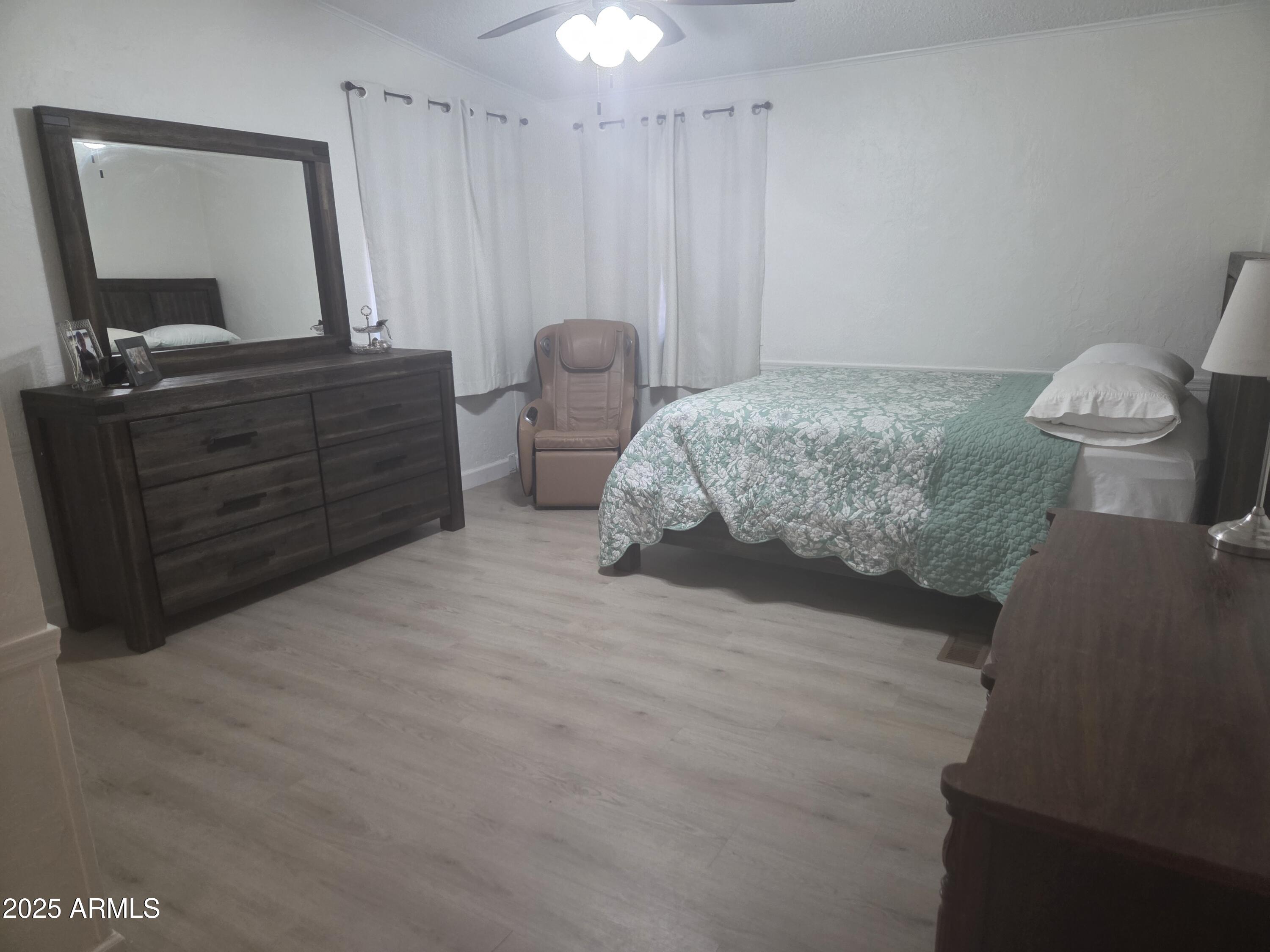 115 South Young Road Payson, AZ 85541 - Photo 14 of 34 a bedroom with a bed and a mirror on dresser