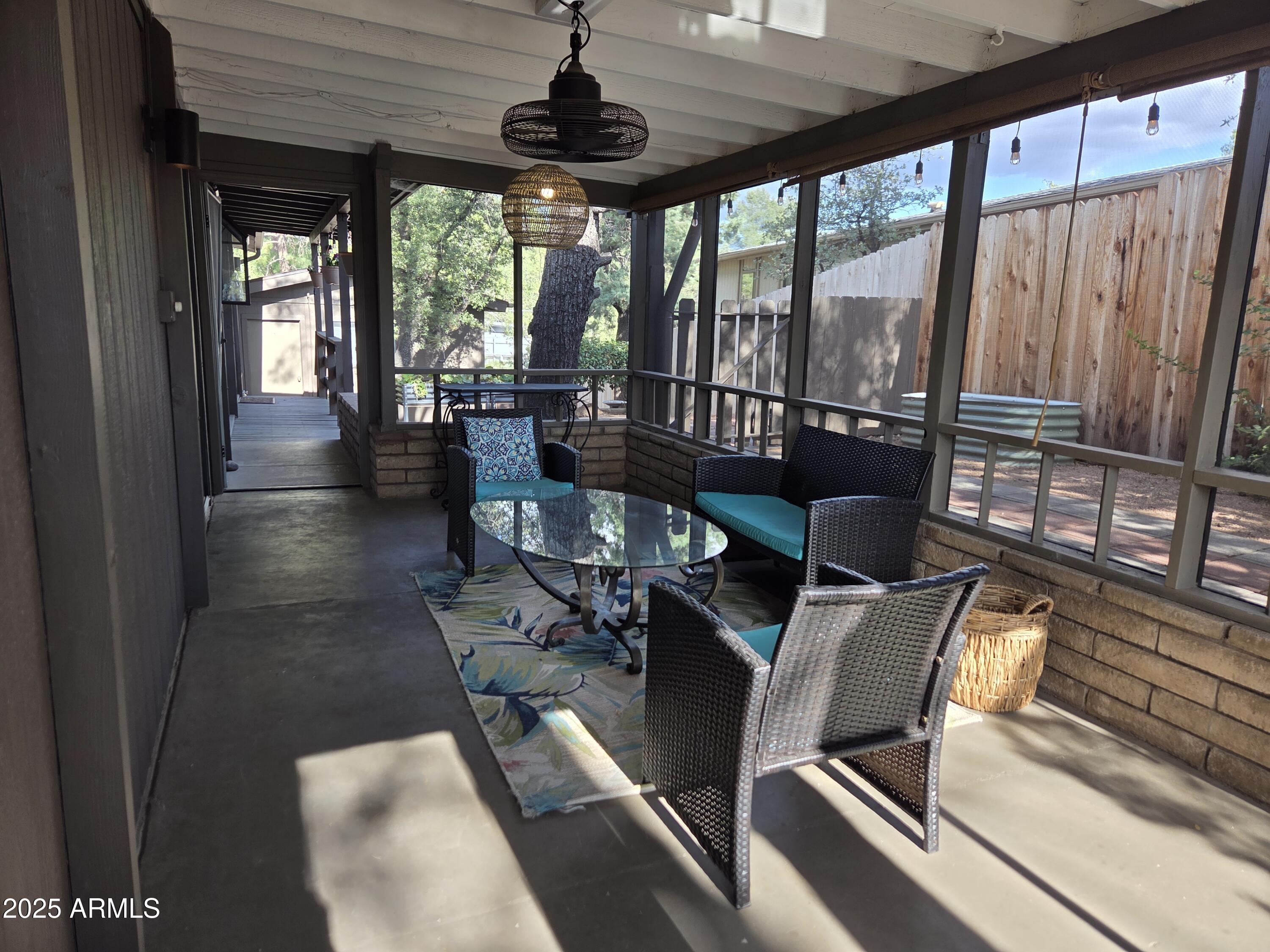 115 South Young Road Payson, AZ 85541 - Photo 21 of 34 a living room with furniture and a floor to ceiling window