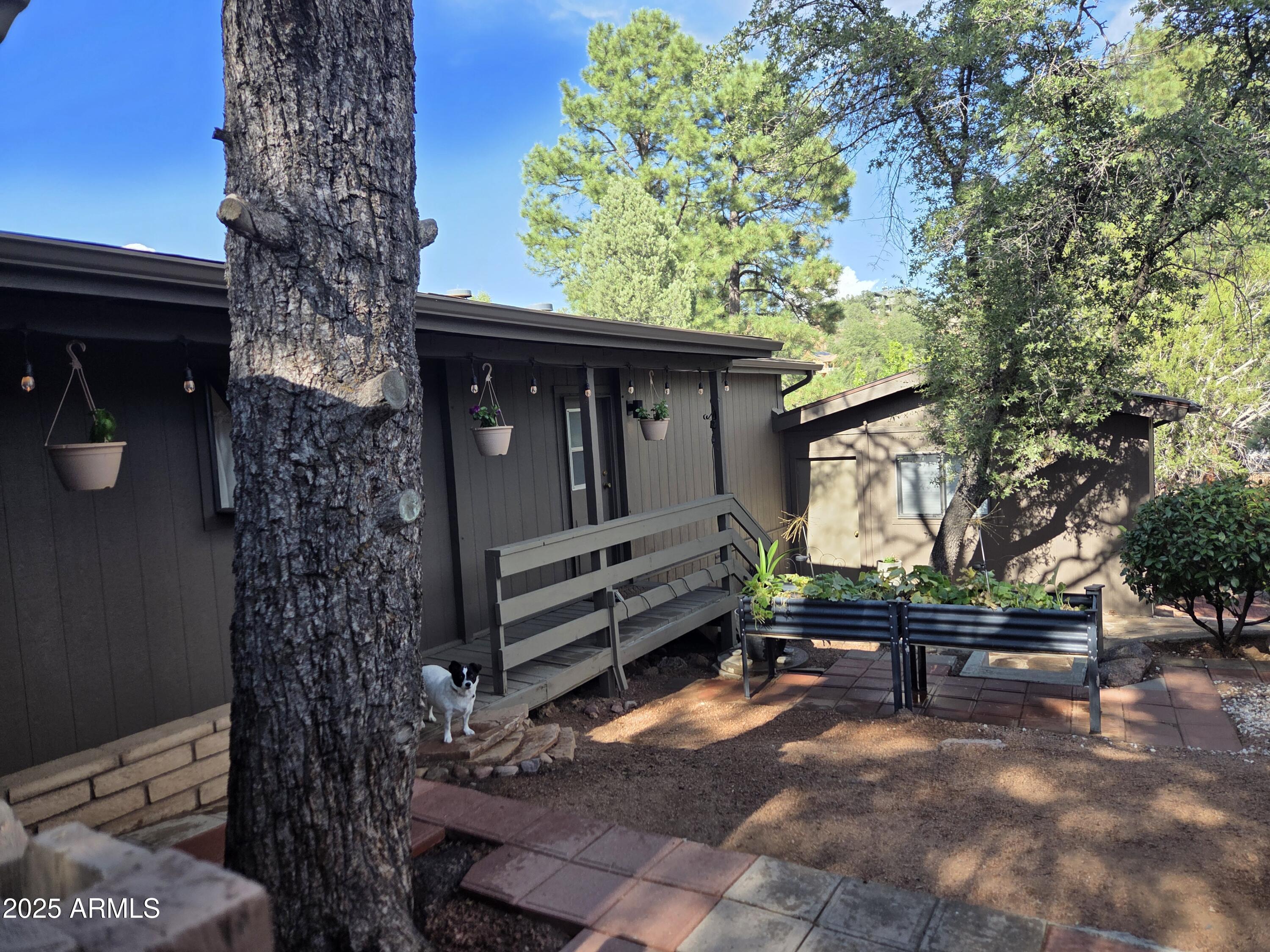 115 South Young Road Payson, AZ 85541 - Photo 23 of 34 a backyard of a house with barbeque oven table and chairs
