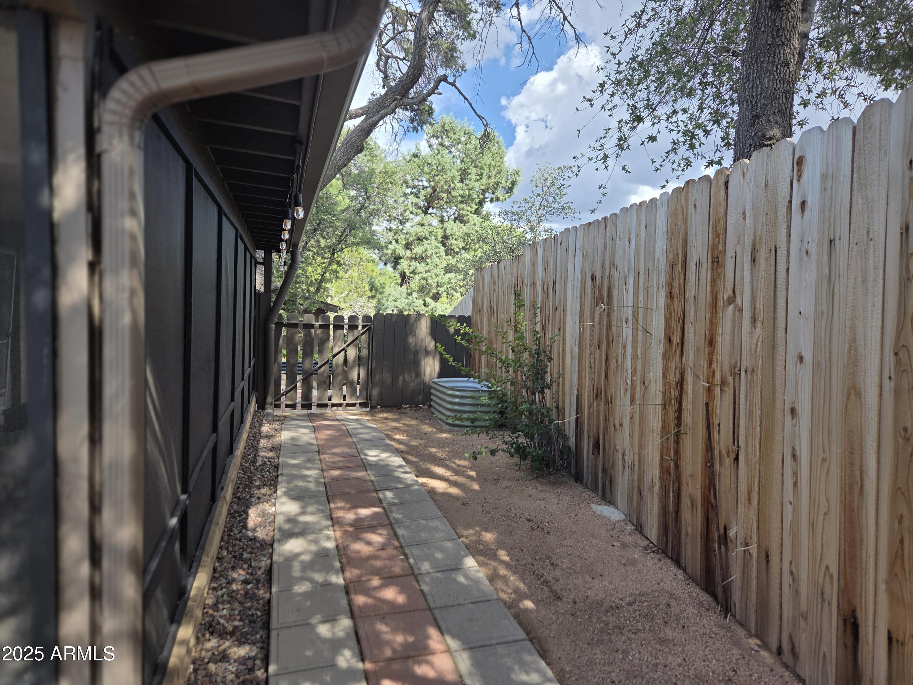 115 South Young Road Payson, AZ 85541 - Photo 28 of 34 a view of a pathway with a wooden fence