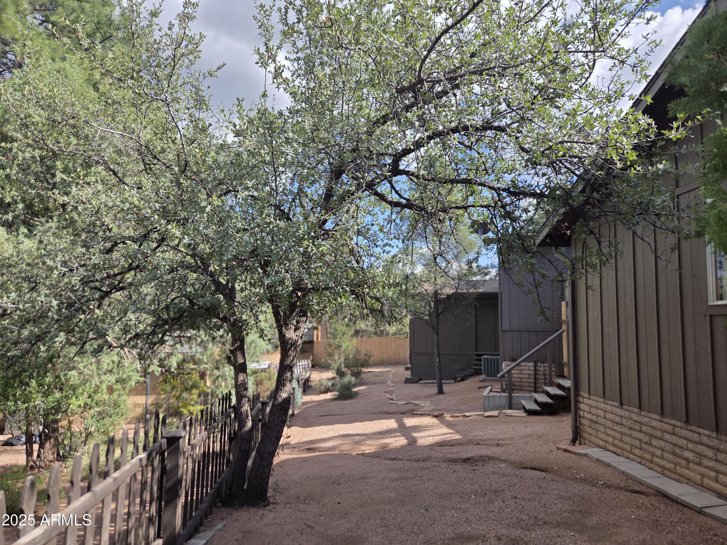 115 South Young Road Payson, AZ 85541 - Photo 33 of 34 a view of a house with backyard and a tree