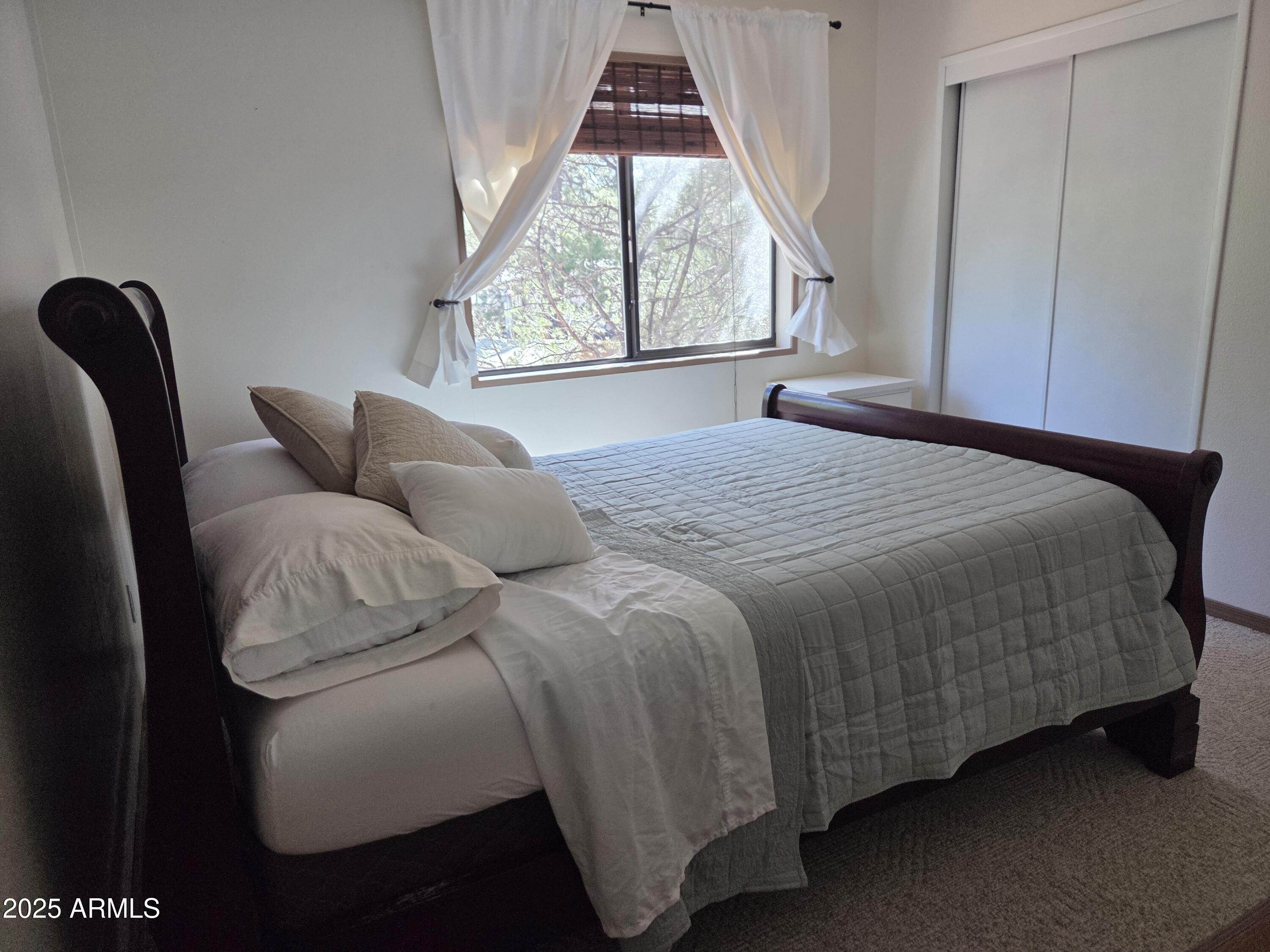 115 South Young Road Payson, AZ 85541 - Photo 10 of 34 a bedroom with a bed and window