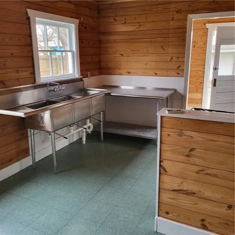 a room with table chair and window