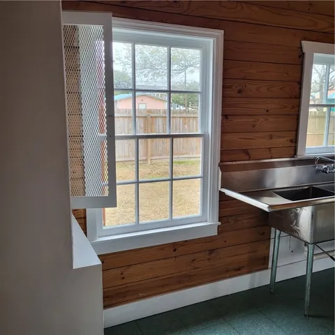 a kitchen with table and window