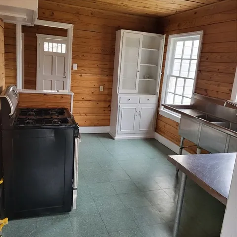 a kitchen with a stove and a cabinet
