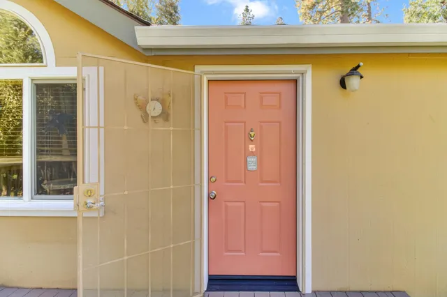 a view of a livingroom with wooden floor and furniture