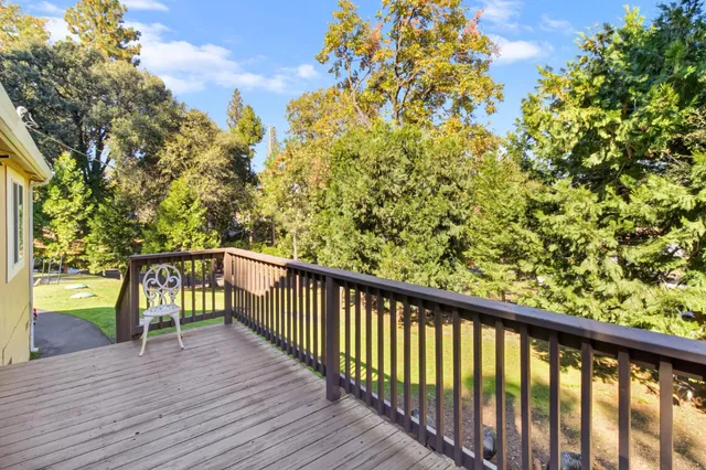 a view of a balcony with wooden floor
