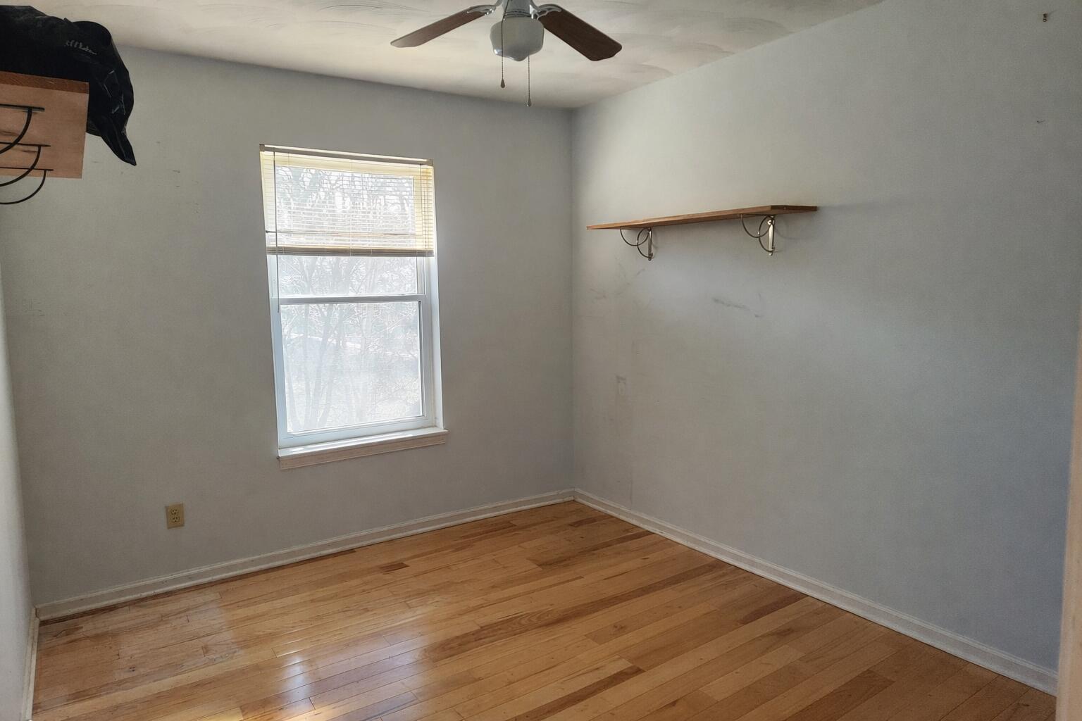 97 Cedar Lane Hardy, VA 24101 - Photo 8 of 11 an empty room with wooden floor and windows