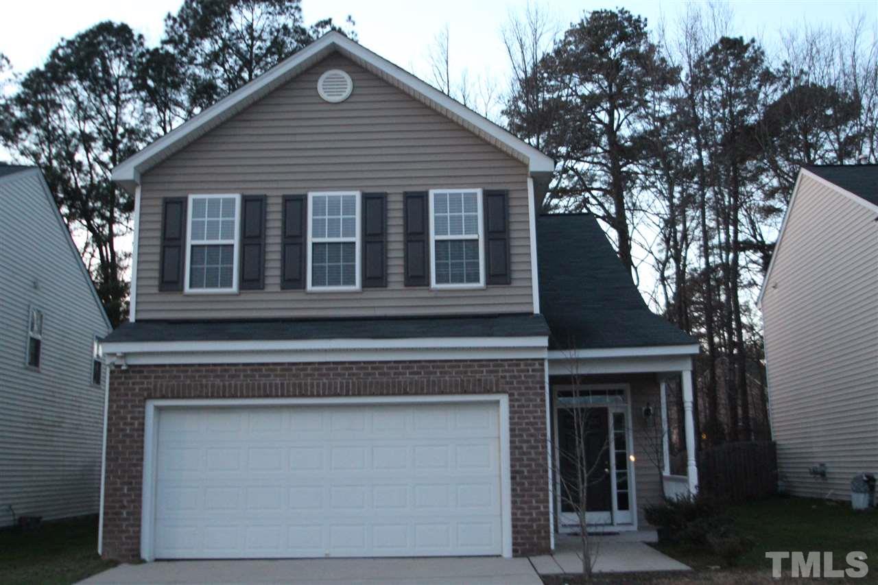 3112 Trassacks Drive Raleigh, NC 27610 - Photo 1 of 13 a front view of a house with a garage