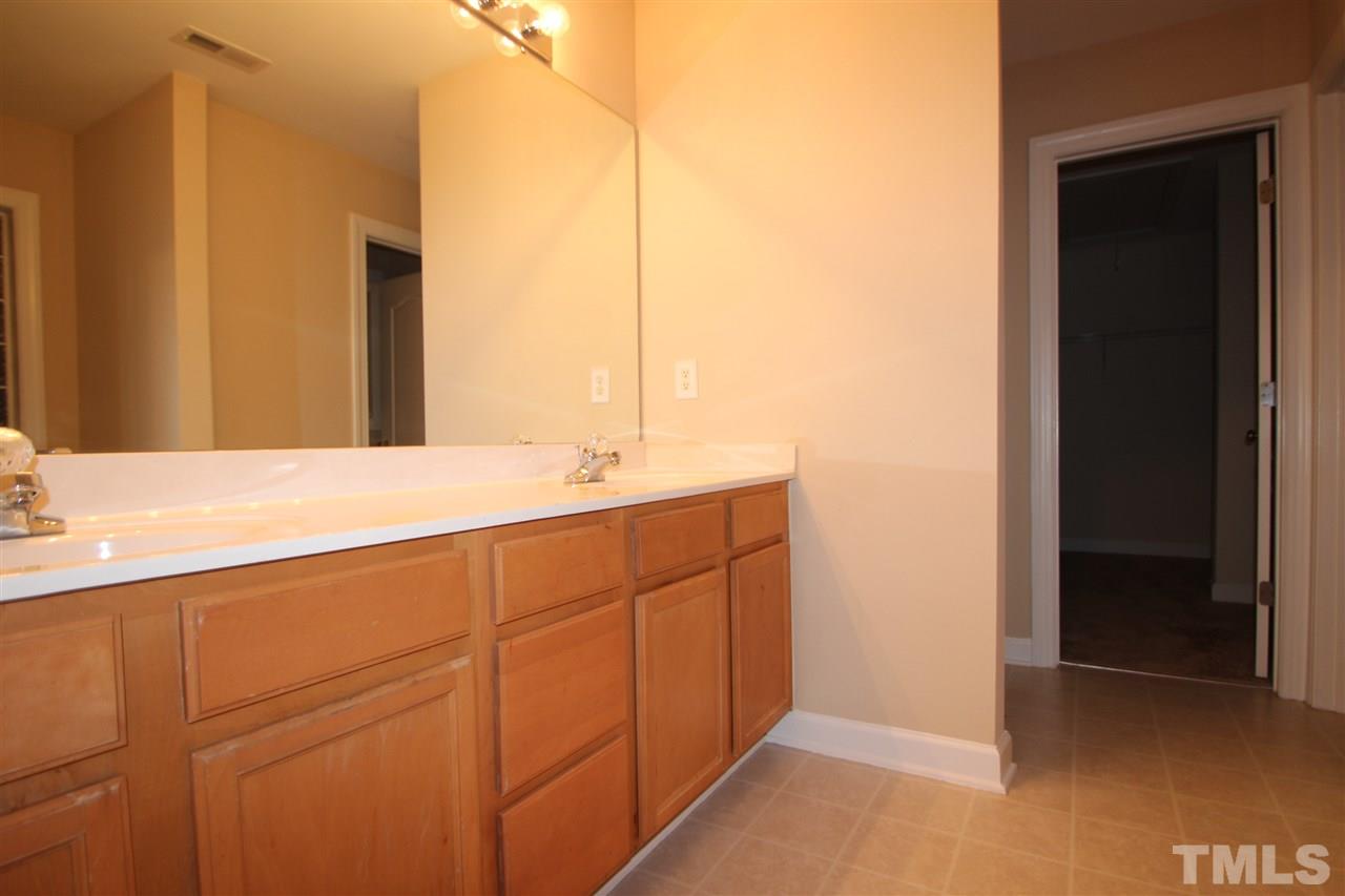 3112 Trassacks Drive Raleigh, NC 27610 - Photo 11 of 13 a bathroom with a sink and a mirror