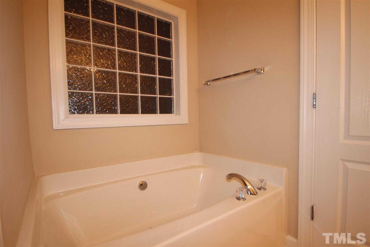 3112 Trassacks Drive Raleigh, NC 27610 - Photo 12 of 13 a bathroom with a bathtub
