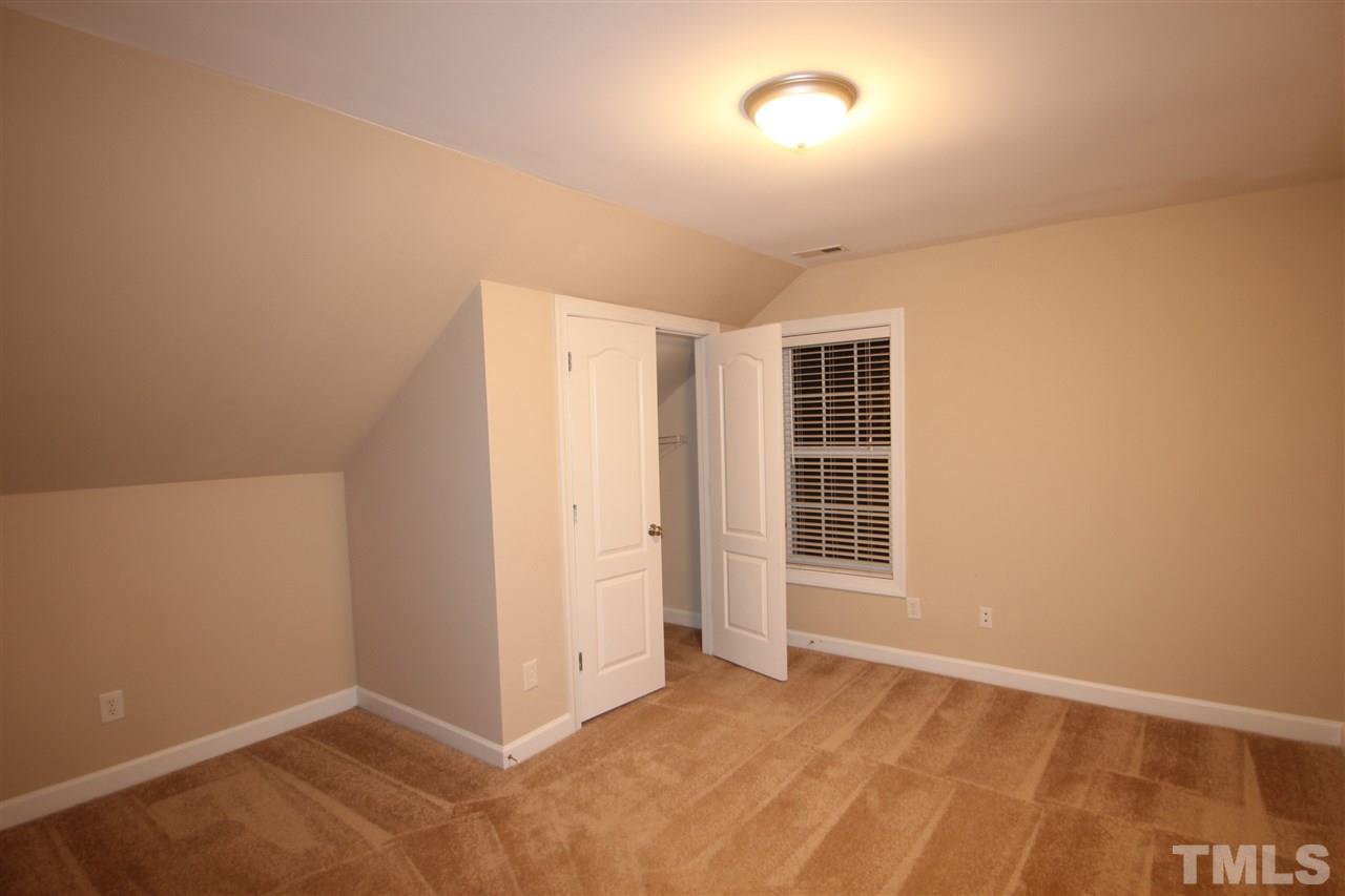 3112 Trassacks Drive Raleigh, NC 27610 - Photo 9 of 13 an empty room with windows