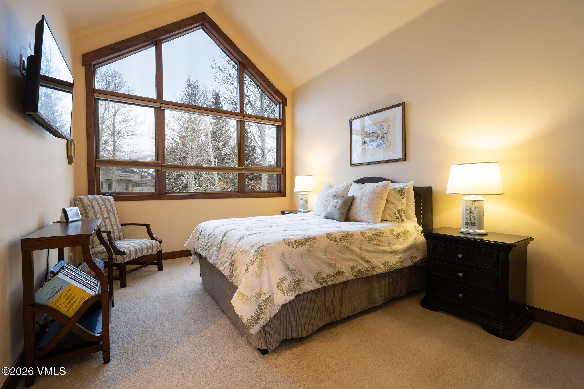 150 Buckboard Road Edwards, CO 81632 - Photo 16 of 27 a bedroom with a bed and a large window