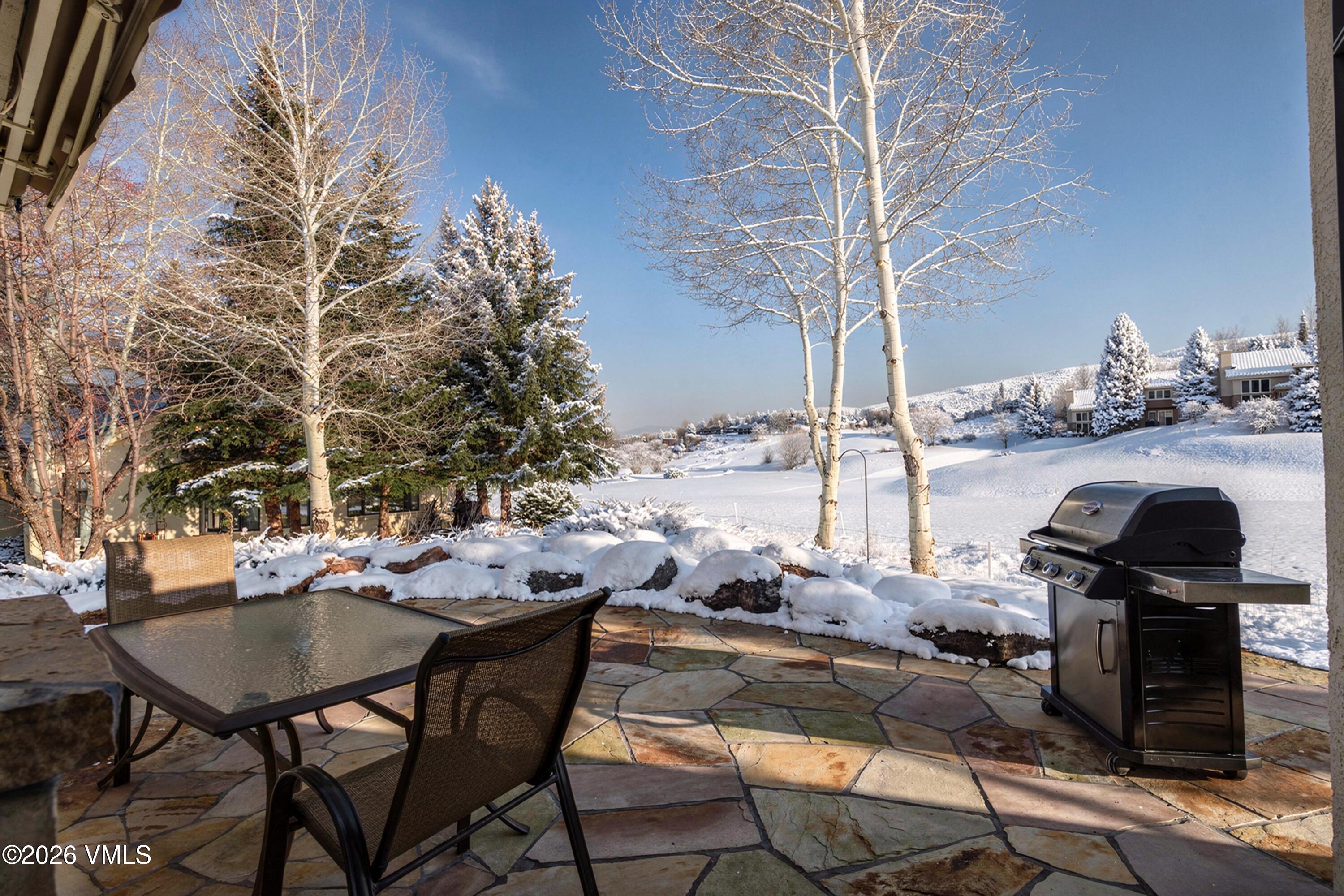 150 Buckboard Road Edwards, CO 81632 - Photo 23 of 27 a view of a chairs and table in the patio