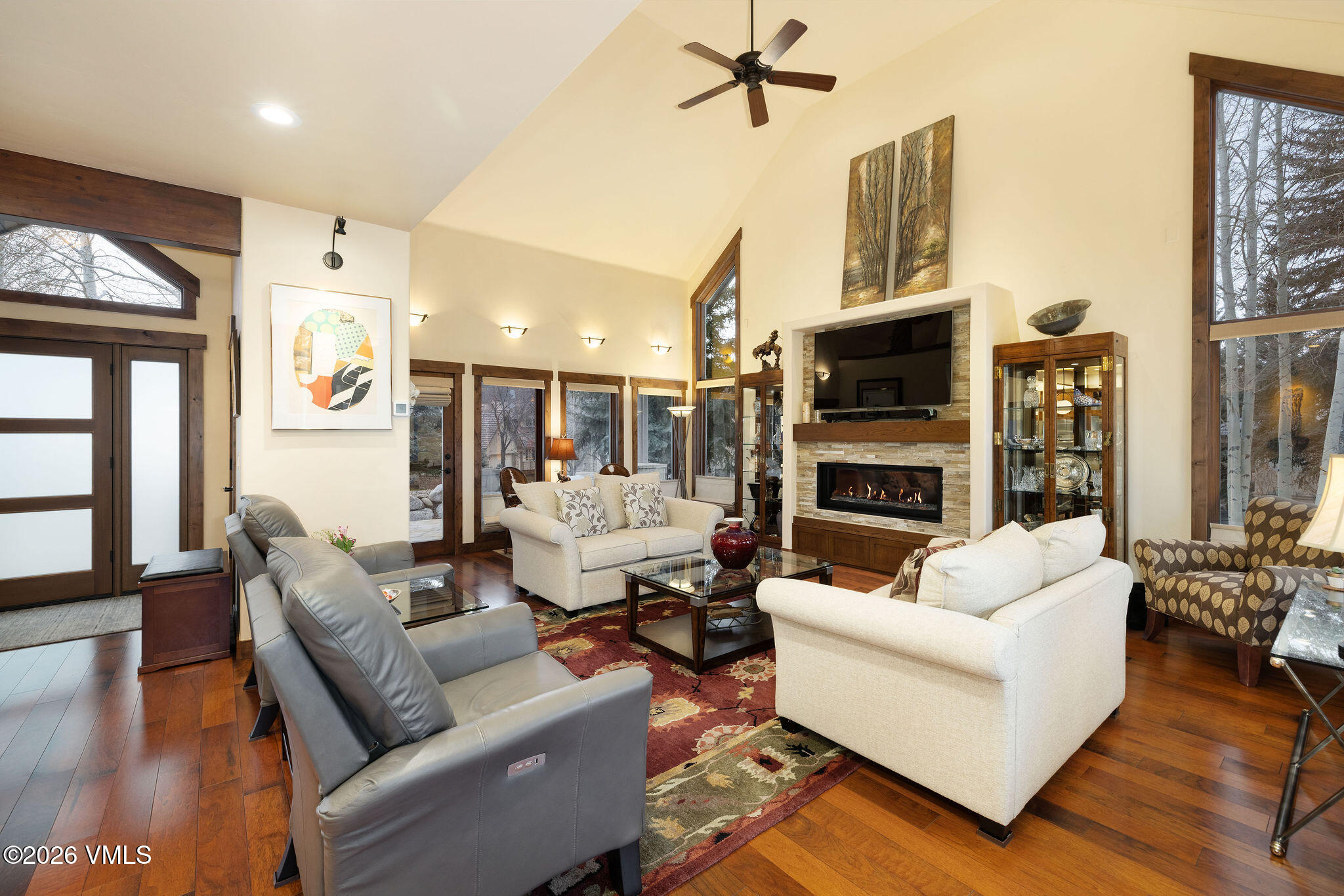 150 Buckboard Road Edwards, CO 81632 - Photo 4 of 27 a living room with fireplace furniture and a flat screen tv