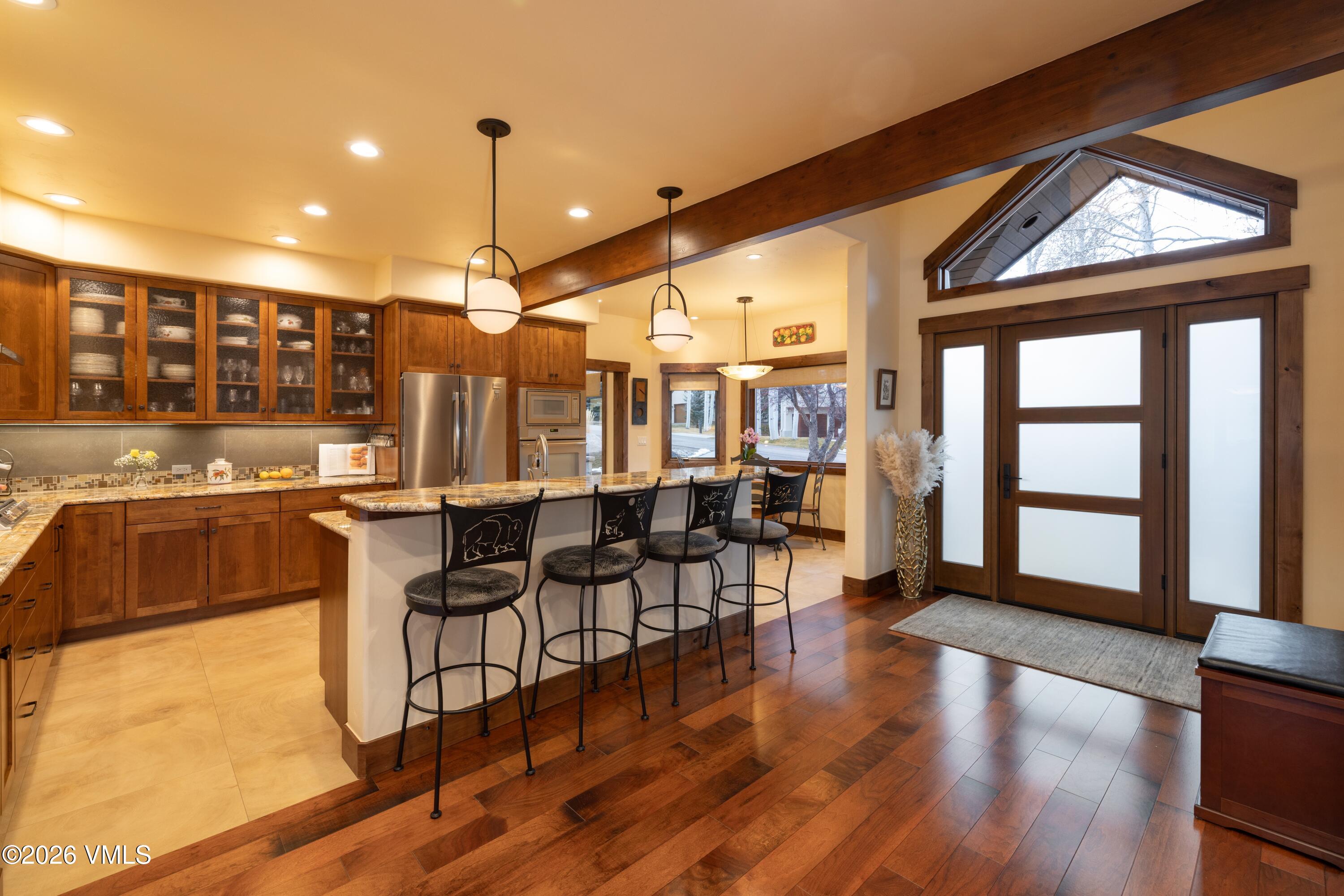 150 Buckboard Road Edwards, CO 81632 - Photo 5 of 27 a very nice looking living room with dining room and wooden floor