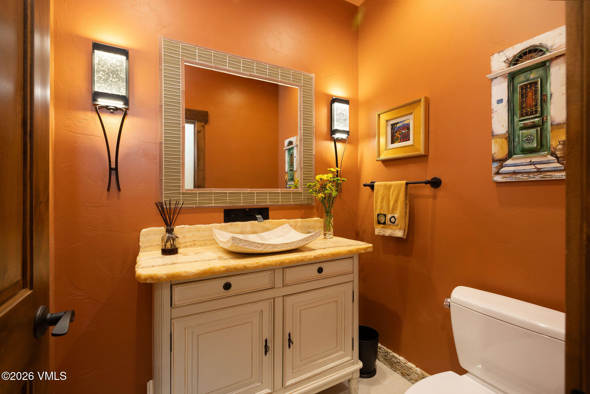 150 Buckboard Road Edwards, CO 81632 - Photo 10 of 27 a bathroom with a sink a toilet and mirror