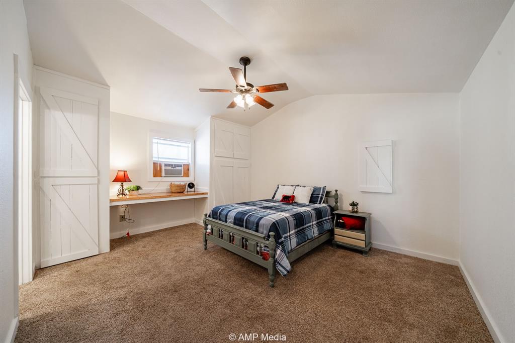 941 Harold Street Albany, TX 76430 - Photo 13 of 22 a living room with furniture and a chandelier