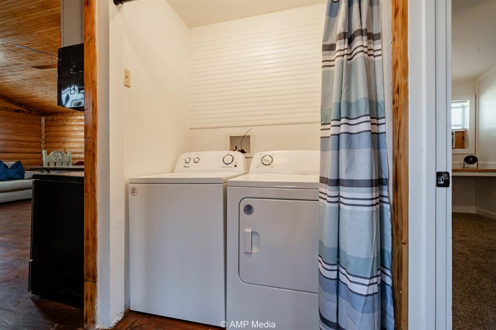 941 Harold Street Albany, TX 76430 - Photo 18 of 22 a utility room with dryer and washer