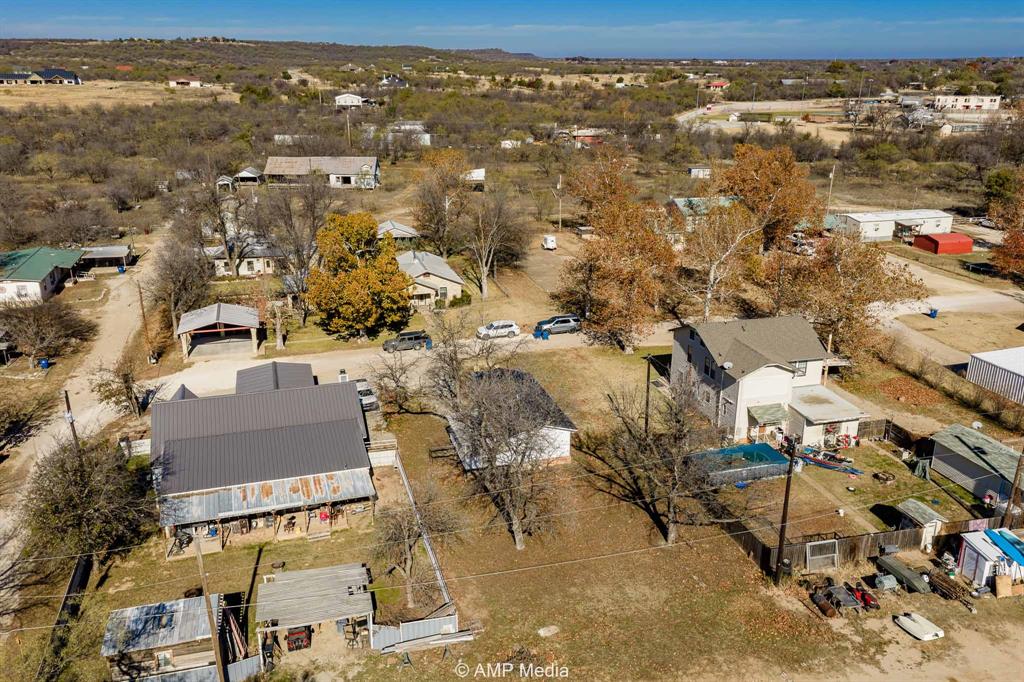 941 Harold Street Albany, TX 76430 - Photo 22 of 22 an aerial view of residential houses with city view