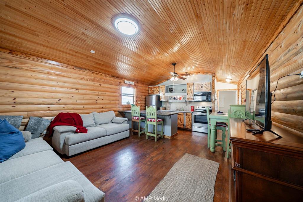 941 Harold Street Albany, TX 76430 - Photo 5 of 22 a living room with furniture and wooden floor