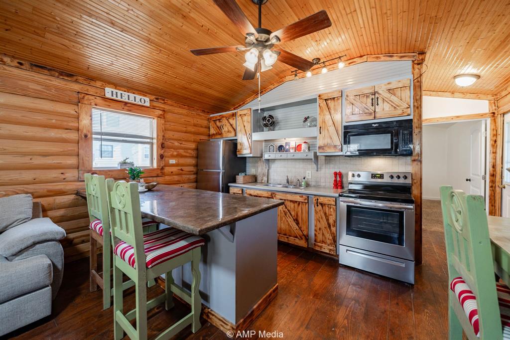 941 Harold Street Albany, TX 76430 - Photo 6 of 22 a kitchen with a sink appliances and cabinets