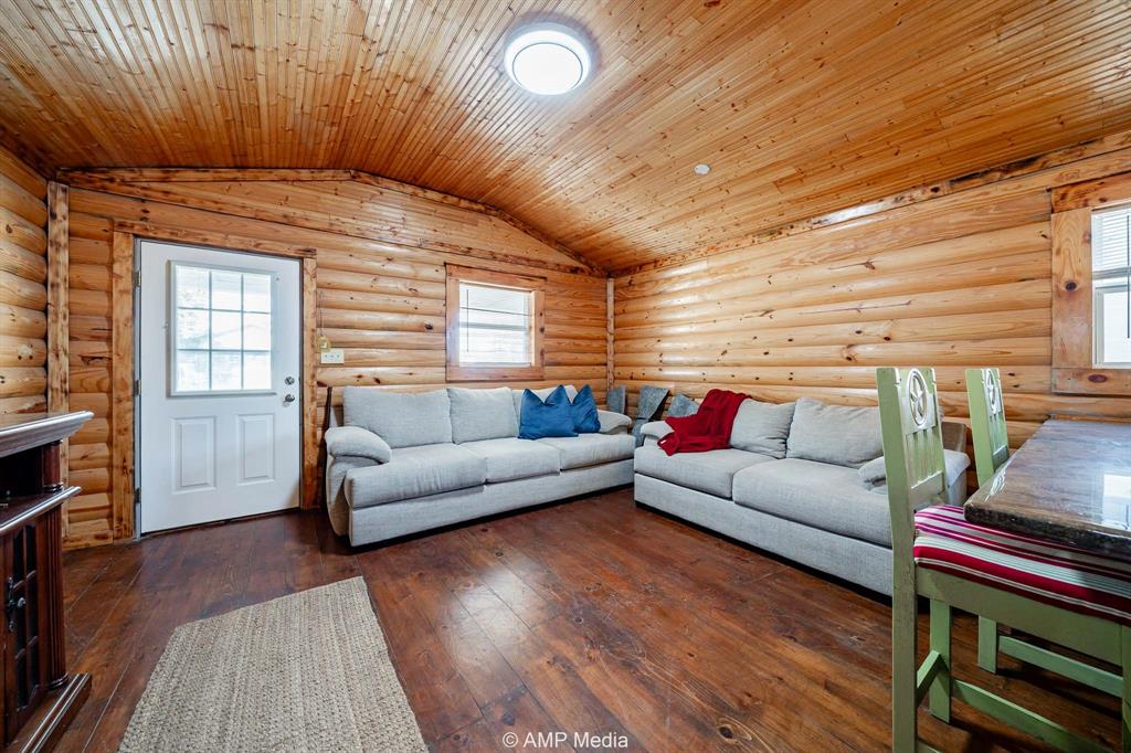 941 Harold Street Albany, TX 76430 - Photo 7 of 22 a living room with furniture and wooden floor