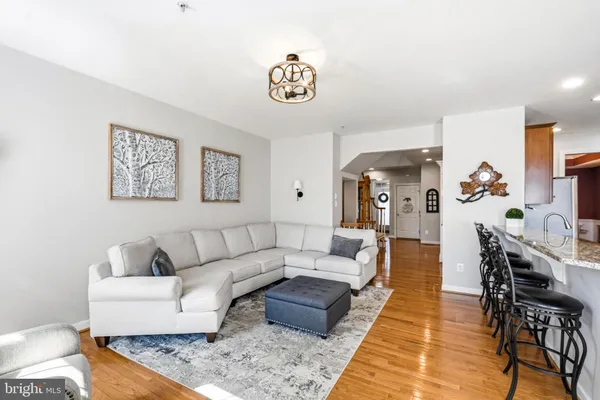 a living room with fireplace furniture and a flat screen tv