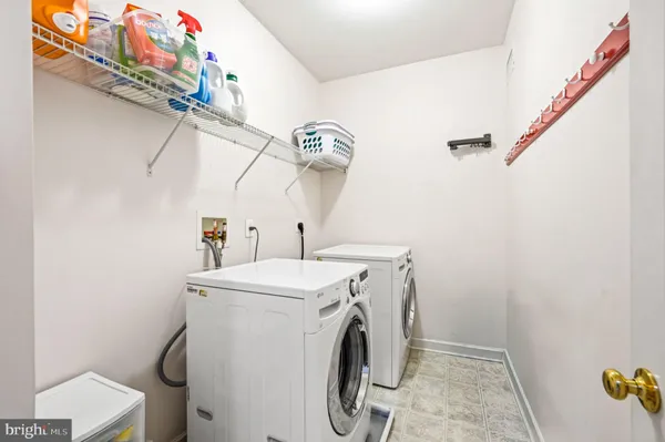 a spacious bathroom with a tub sink and mirror