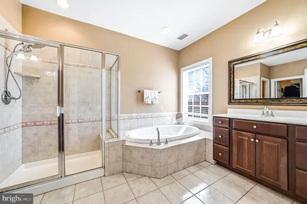 a bathroom with a granite countertop sink and a granite top