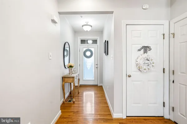 a view of an entryway with wooden floor