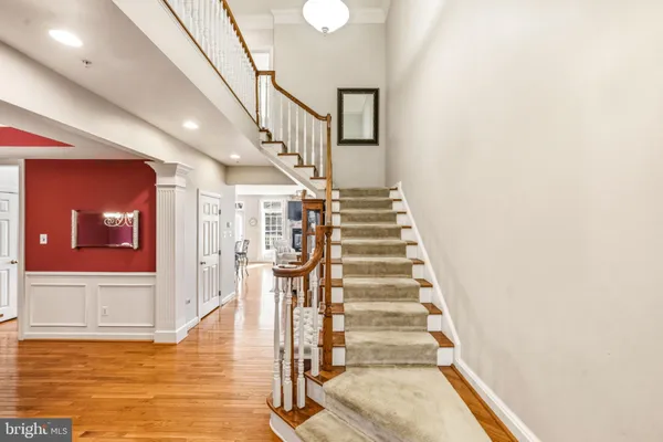 a view of entryway livingroom and hall with wooden floor