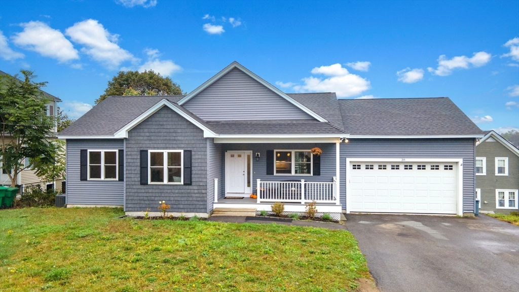 a view of a house with a yard