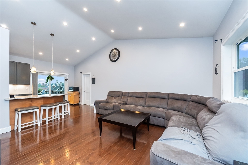 38 Norman Street Clinton, MA 01510 - Photo 12 of 40 a living room with furniture and a wooden floor