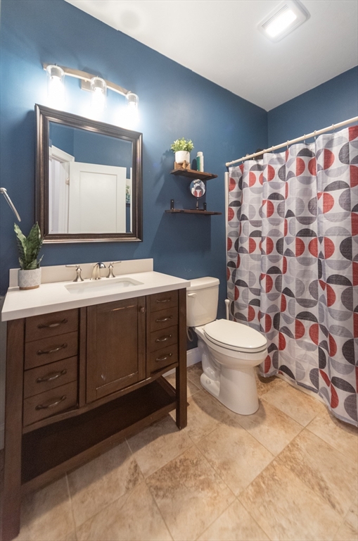 38 Norman Street Clinton, MA 01510 - Photo 13 of 40 a bathroom with a toilet sink and mirror