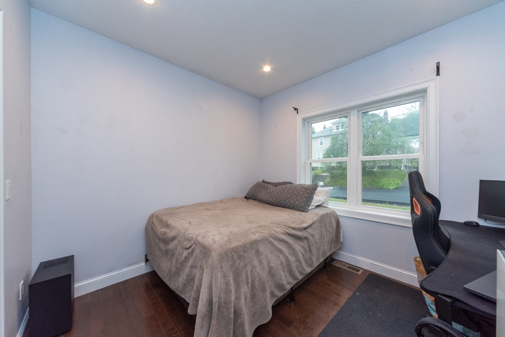 38 Norman Street Clinton, MA 01510 - Photo 20 of 40 a bedroom with a bed and a window