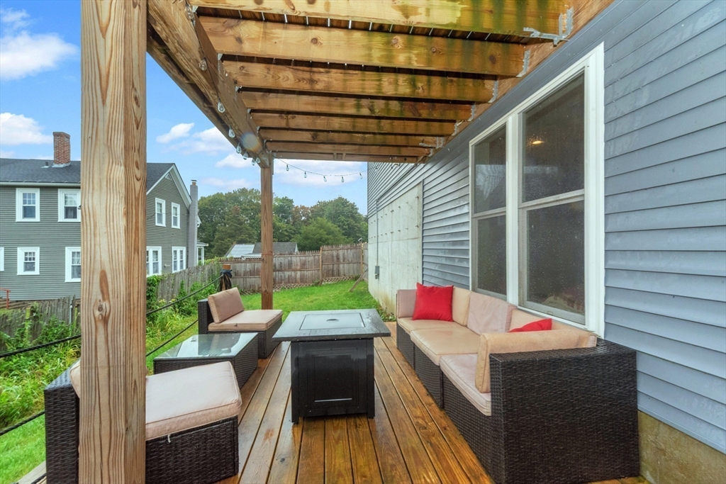 38 Norman Street Clinton, MA 01510 - Photo 24 of 40 a balcony with furniture and a potted plant