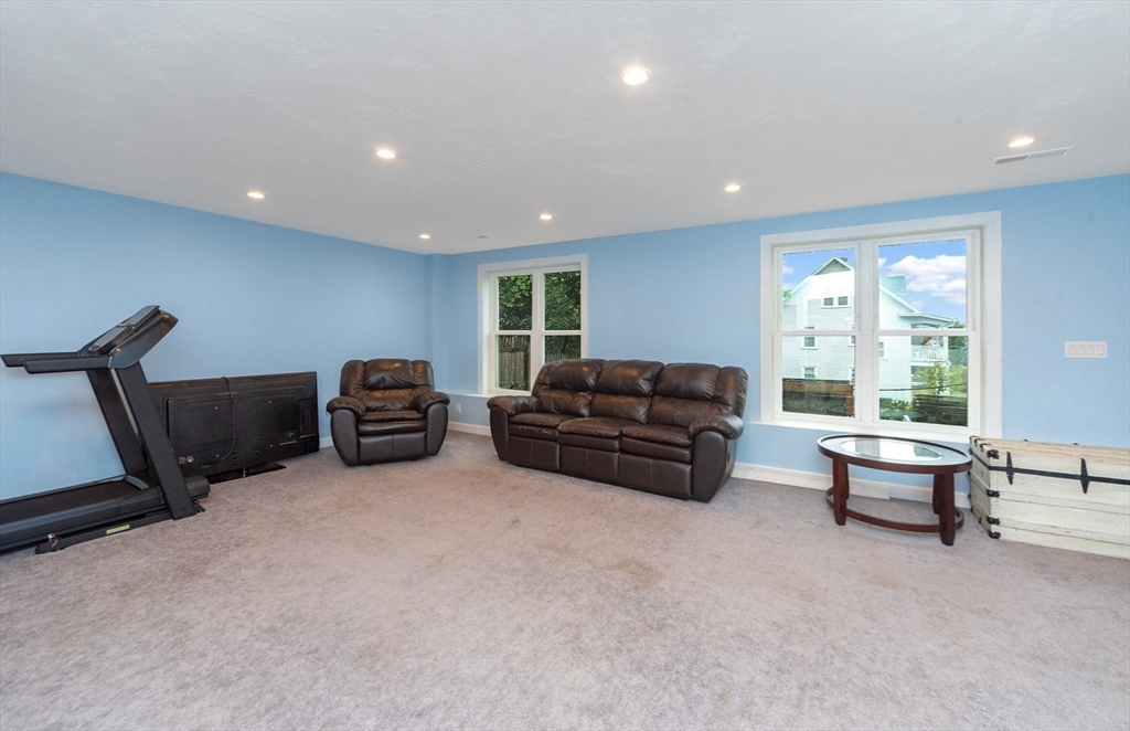 38 Norman Street Clinton, MA 01510 - Photo 25 of 40 a living room with furniture and a flat screen tv