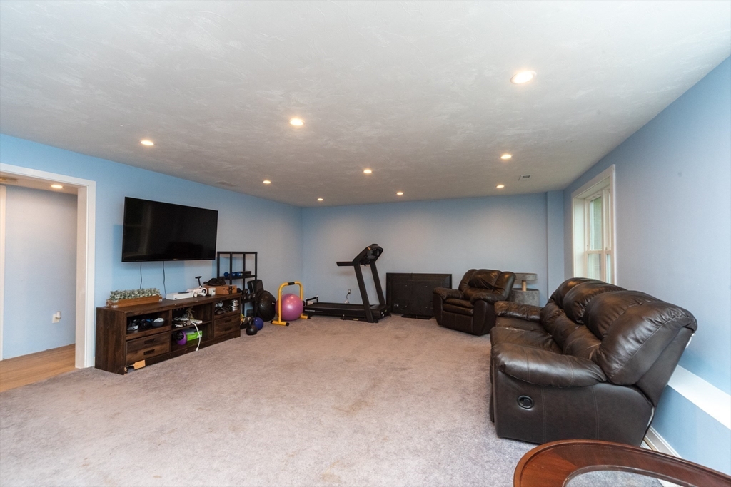 38 Norman Street Clinton, MA 01510 - Photo 26 of 40 a living room with furniture and a flat screen tv