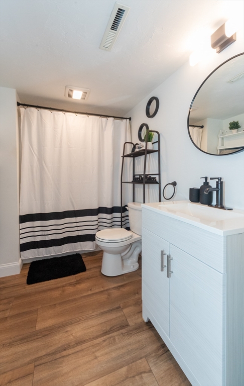 38 Norman Street Clinton, MA 01510 - Photo 28 of 40 a bathroom with a sink mirror and toilet