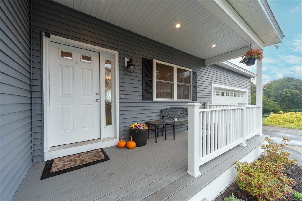 38 Norman Street Clinton, MA 01510 - Photo 3 of 40 a view of front door and deck of the house