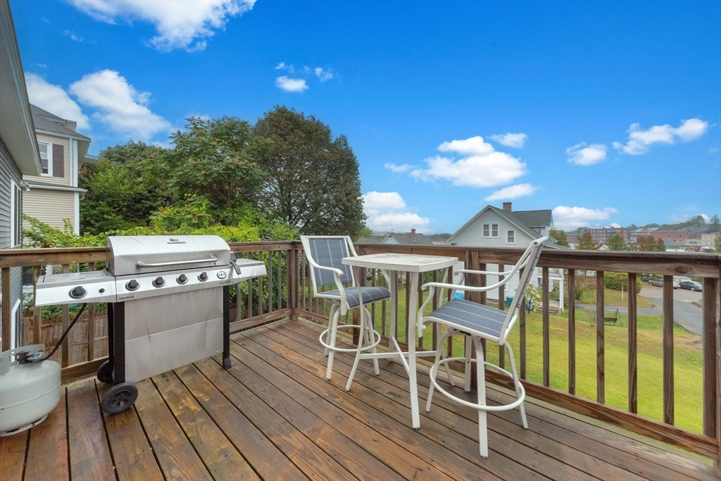 38 Norman Street Clinton, MA 01510 - Photo 33 of 40 a view of a chairs and table on the deck