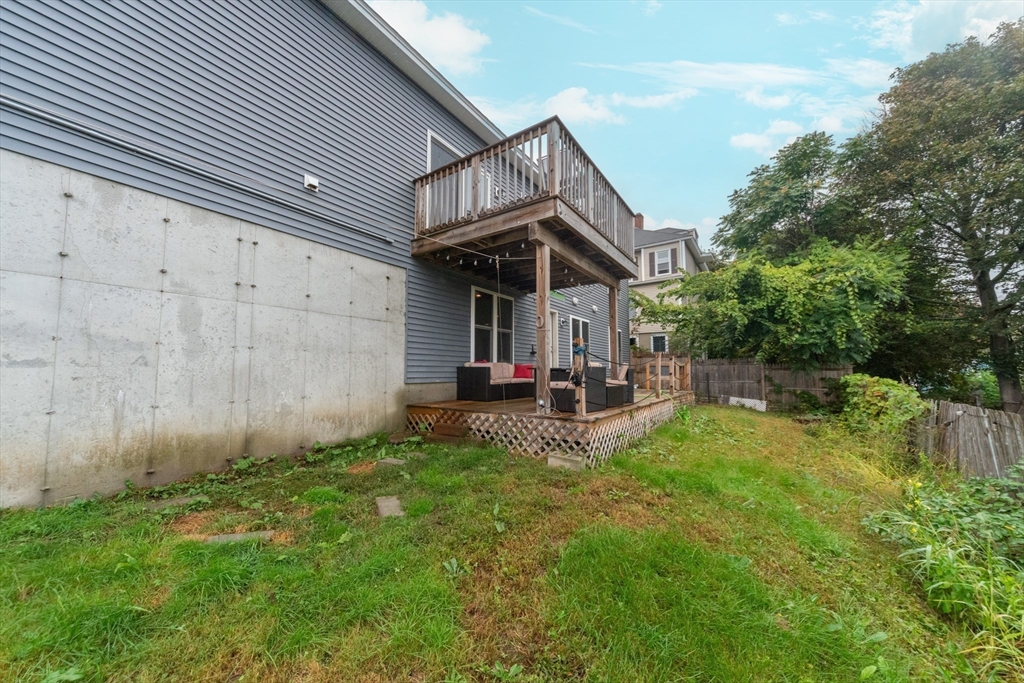 38 Norman Street Clinton, MA 01510 - Photo 34 of 40 a view of a chair and table in backyard of the house