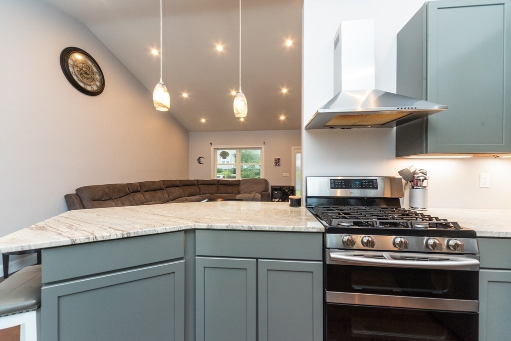 38 Norman Street Clinton, MA 01510 - Photo 8 of 40 a kitchen with a stove and a clock