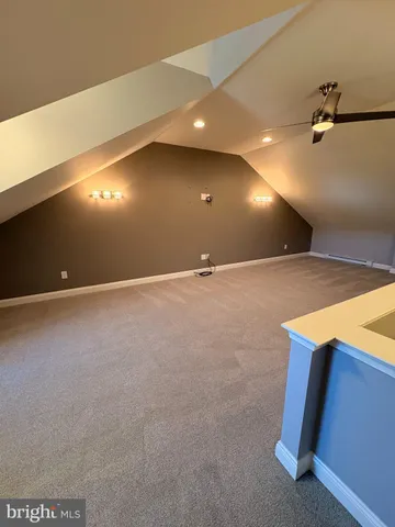 a view of an empty room with a fireplace