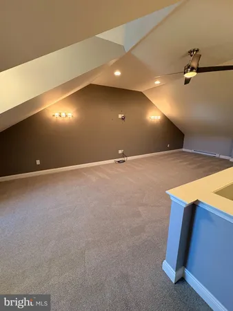 a view of an empty room with a fireplace