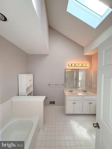 a bathroom with a sink a toilet and bathtub